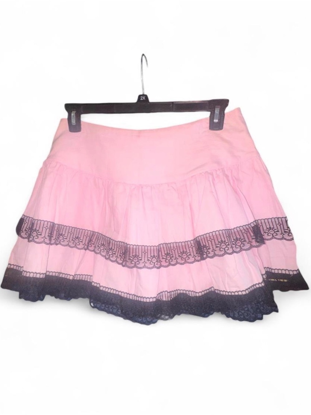 Pink pleated mini skirt with black lace trim